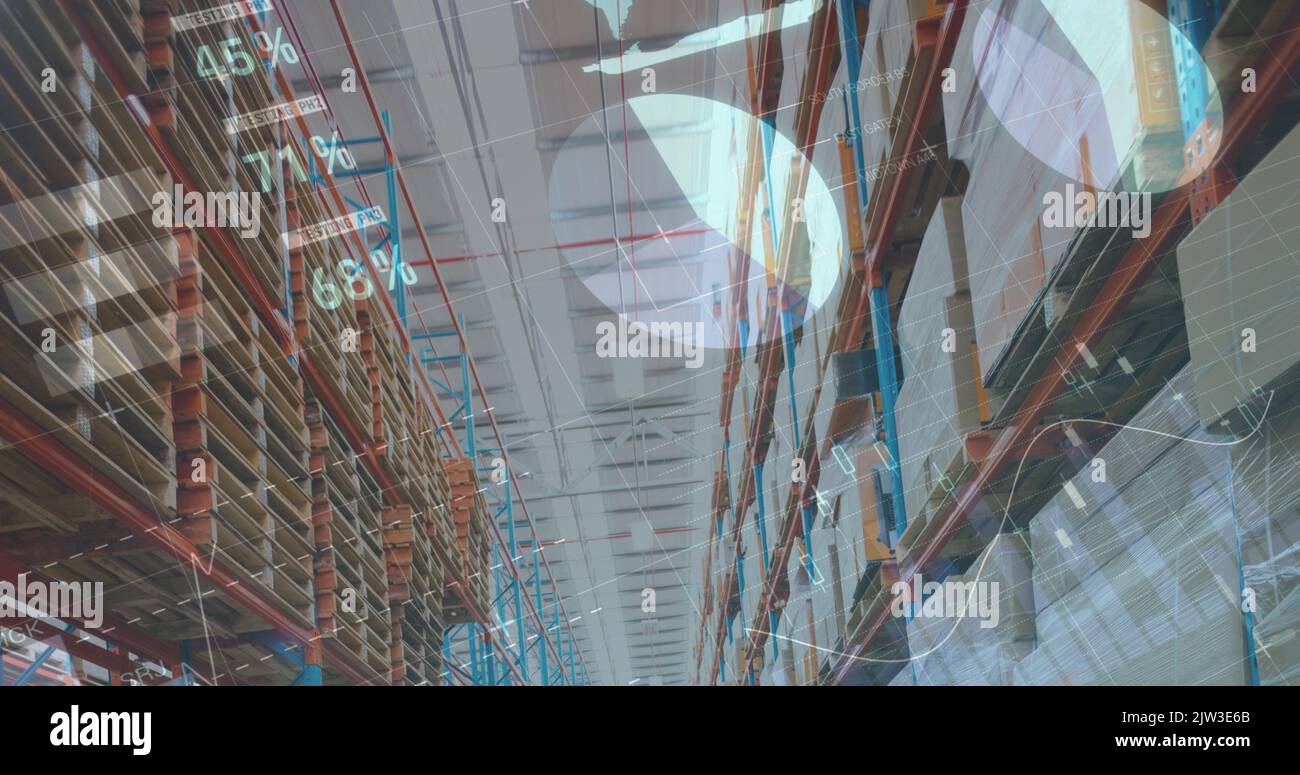 Image of financial data and graphs over warehouse Stock Photo