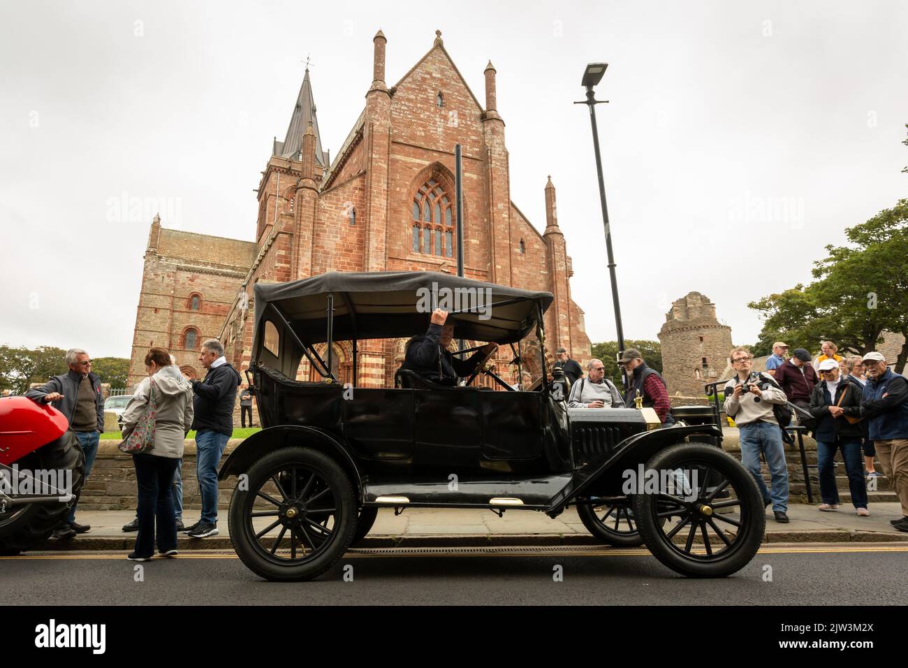 Kirkwall, Orkney, UK. Saturday, 3rd September, 2022. Angus Harcus, 78, with his 1915 Ford Model T car in front of St Magnus Cathedral at the Kirkwall Vintage Car Rally, Kirkwall, Orkney, UK. Mr Harcus's car was imported from Canada in 2006 and is mostly original - just a few minor renovations. The Vintage Car Rally is part of the International Orkney Science Festival. Credit: Peter Lopeman/Alamy Live News Stock Photo