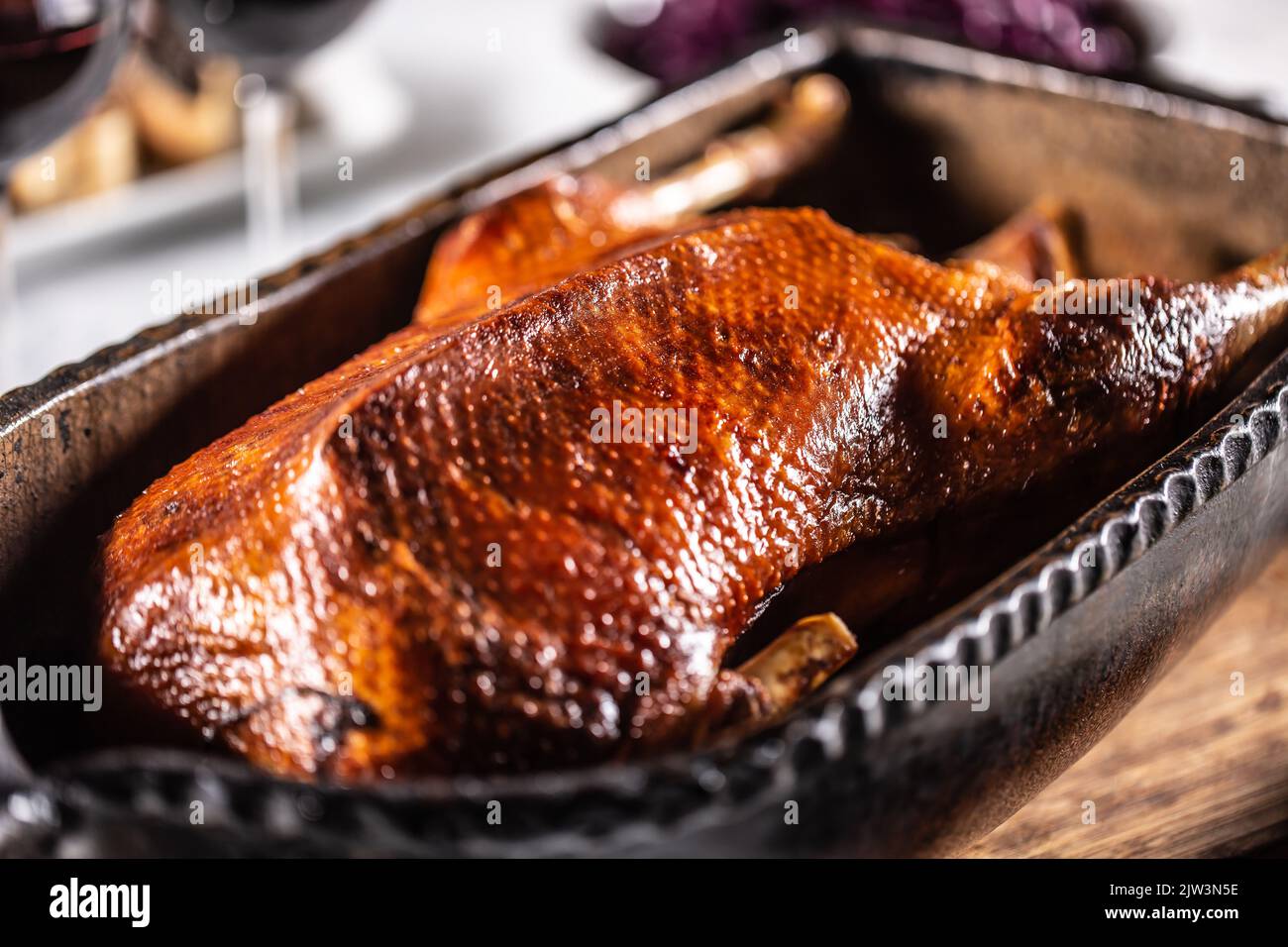 Traditionally roasted goose in an original baking dish. Stock Photo
