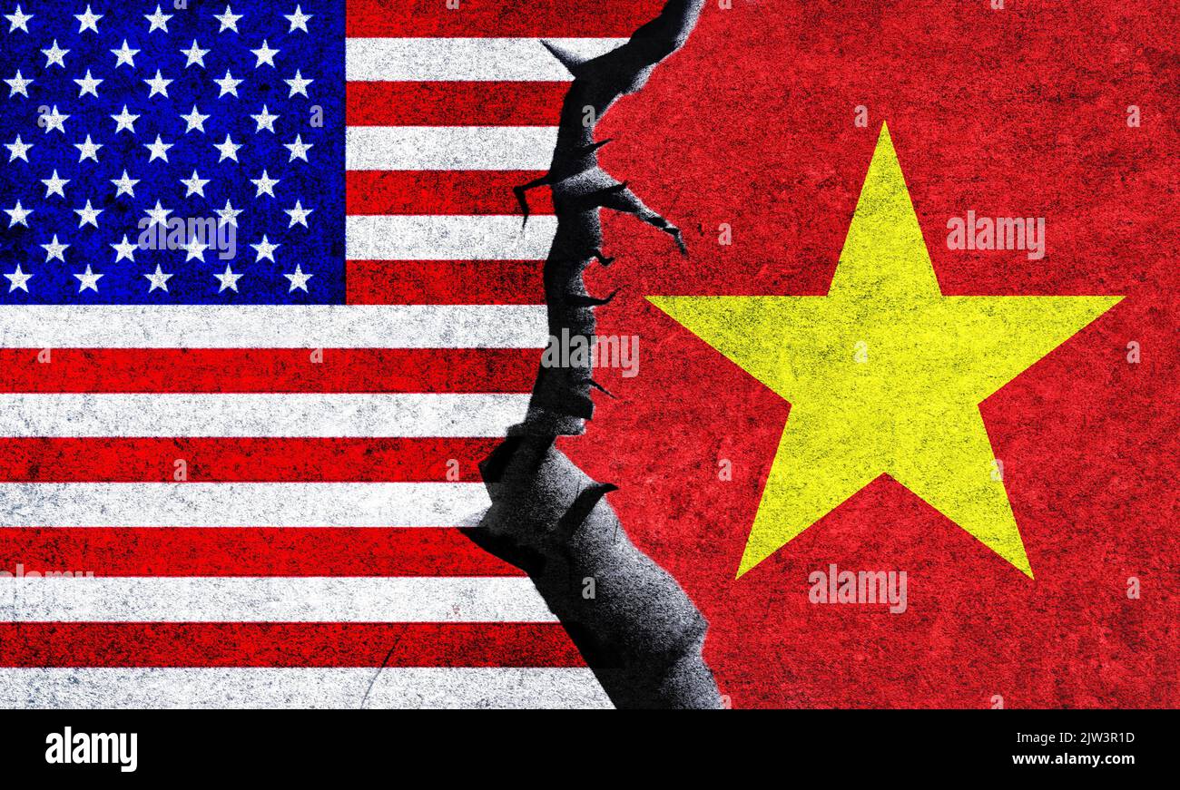 USA vs Vietnam flags on a wall with a crack. Vietnam and United States
