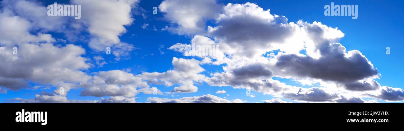 Widescreen panorama of blue sky with white clouds Stock Photo - Alamy