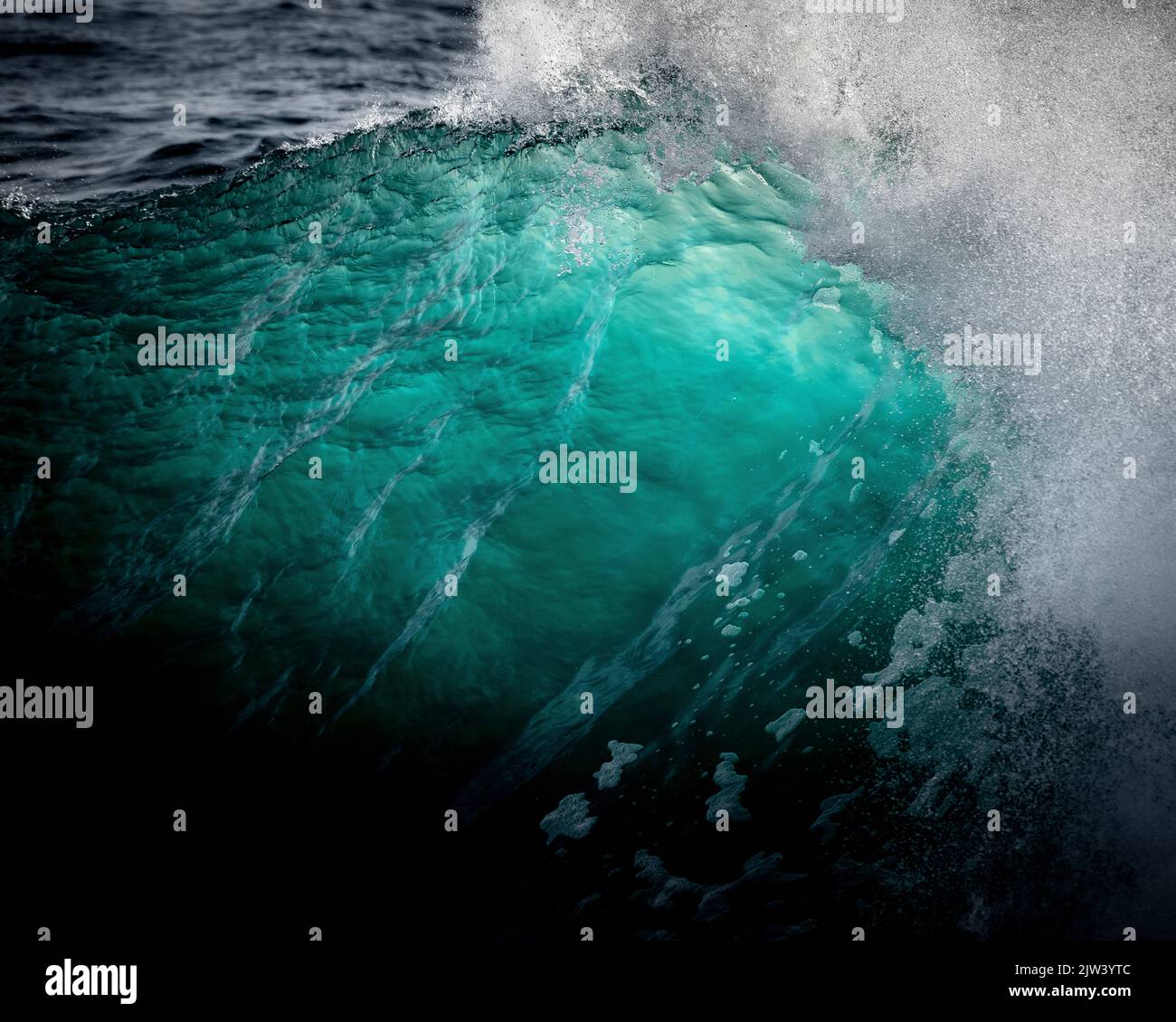 Stunning turquoise aqua waves barrelling into from Porthleven reef