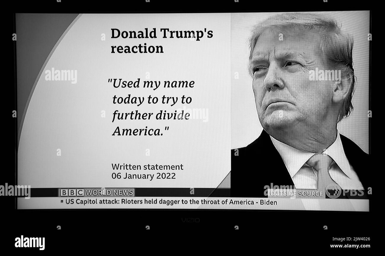 A BBC and PBS screen shot reporting former President Donald Trump's reaction to the one-year anniversary of the January 6 attack on the U.S. Capitol. Stock Photo