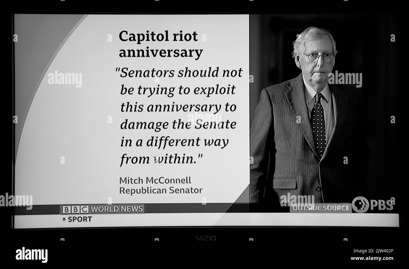 A BBC and PBS screen shot reporting on Senator Mitch McConnnel's reaction to the one-year anniversary of the January 6 attack on the U.S. Capitol. Stock Photo