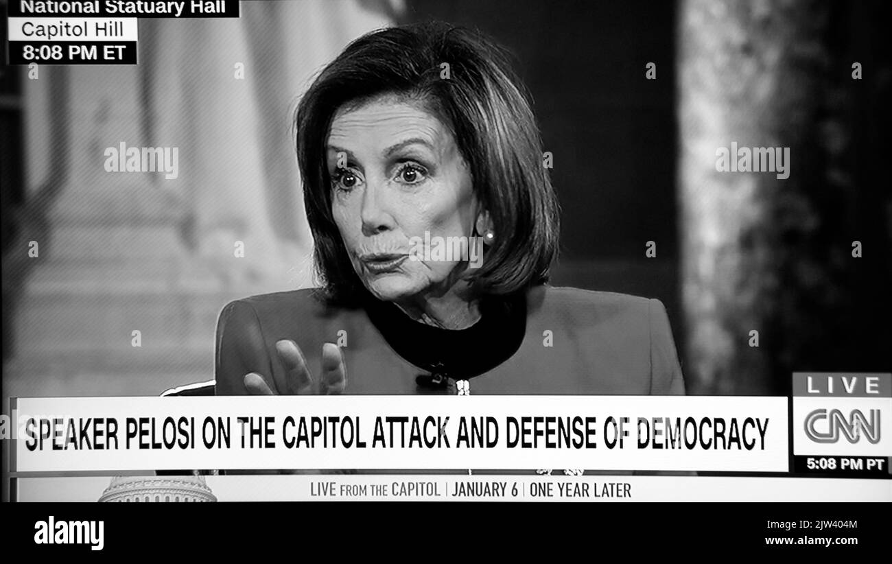 A CNN television screen U.S. House Speaker Nancy Pelosi speaking on the one-year anniversary of the January 6 attack on the U.S. Capitol. Stock Photo