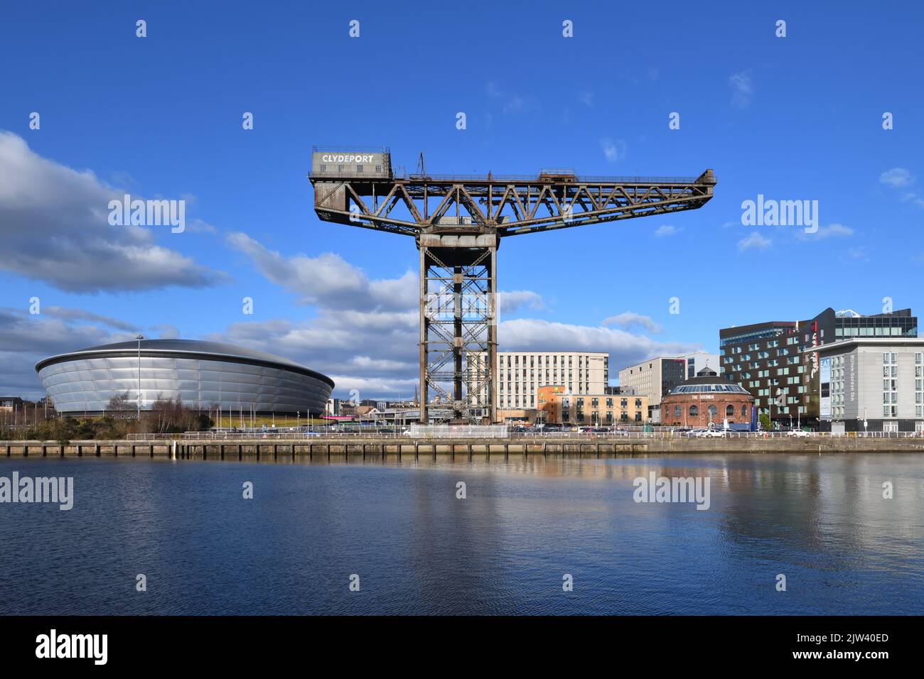 The OVO Hydro, Scottish Event Campus, Finnieston crane and Rotunda viewed from the opposite bank of the river Clyde in Glasgow, Scotland, UK Stock Photo