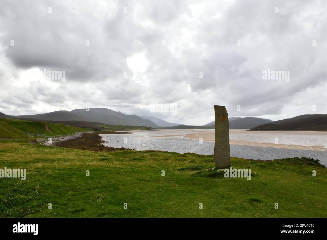 A view south over the tidal Kyle of Durness and 'Stories in sand stone', near Durness on a cloudy day in Scotland Stock Photo