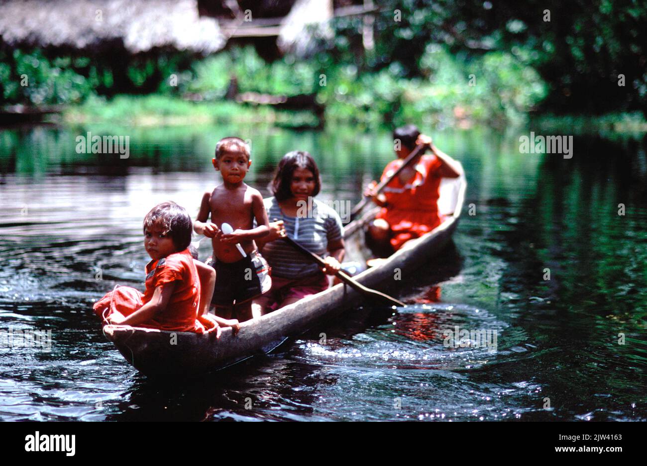 A family of Warao Indians in the Orinoco delta, Venezuela.  The Orinoco basin is threatened by agricultural and mining exploitation and climate change Stock Photo