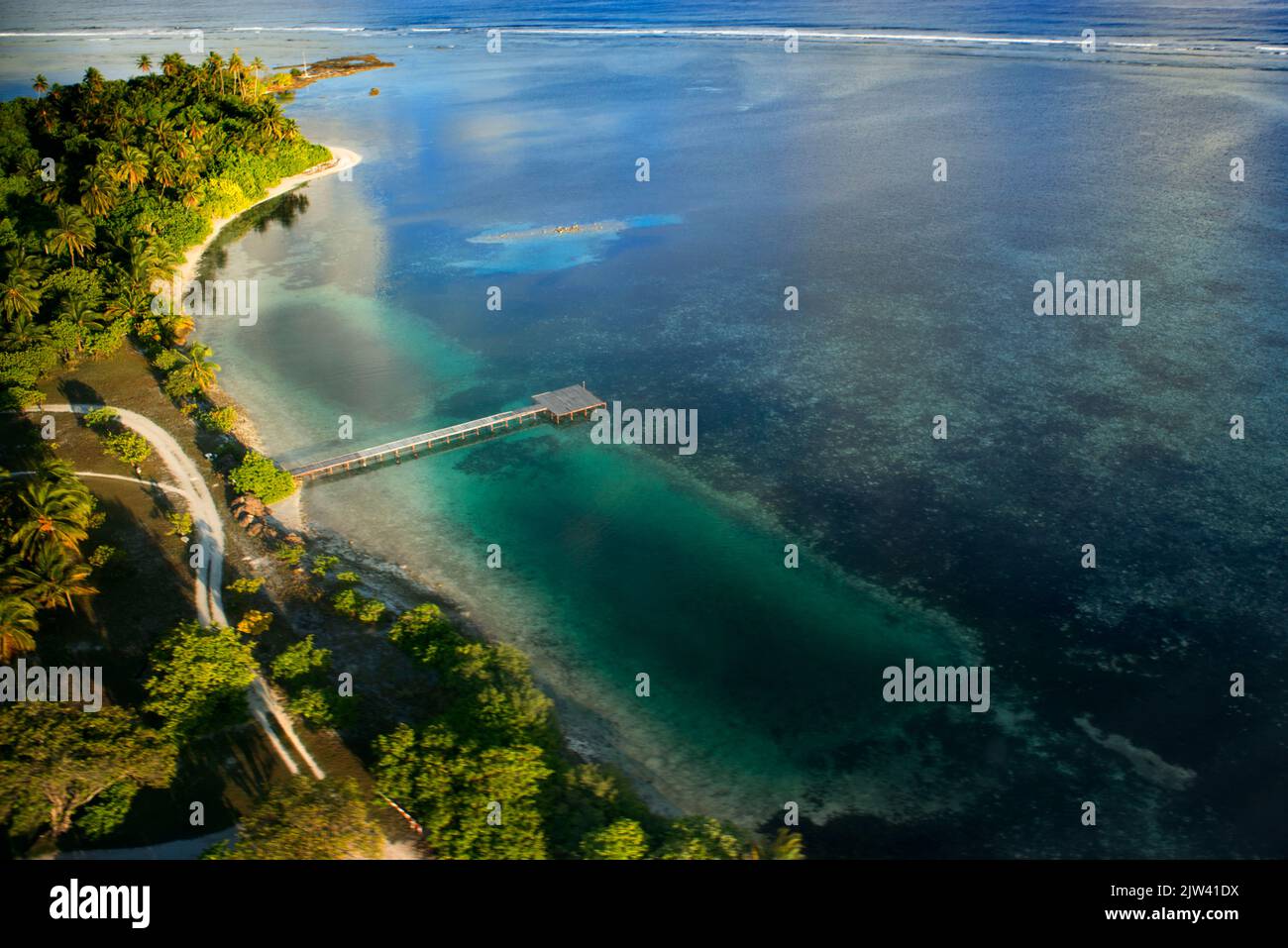 Aerial view on Maldives islands. Gaafu Alifu Atoll  Disappearance of islands. Refugees due to climate change. The sea level rises year after year and Stock Photo