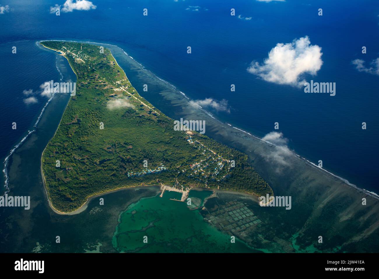 Aerial view on Maldives islands. Gaafu Alifu Atoll.  Disappearance of islands. Refugees due to climate change. The sea level rises year after year and Stock Photo