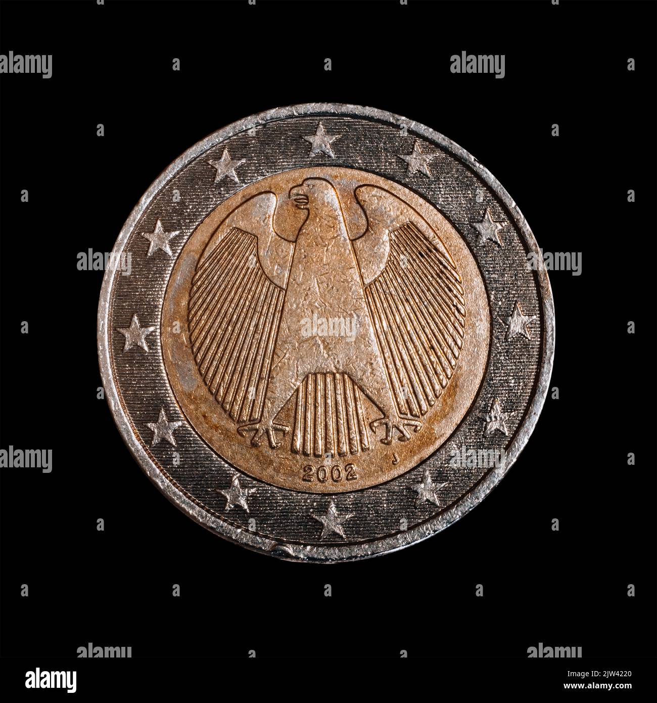 The reverse side of a euro coin isolated on a black background. Stock Photo