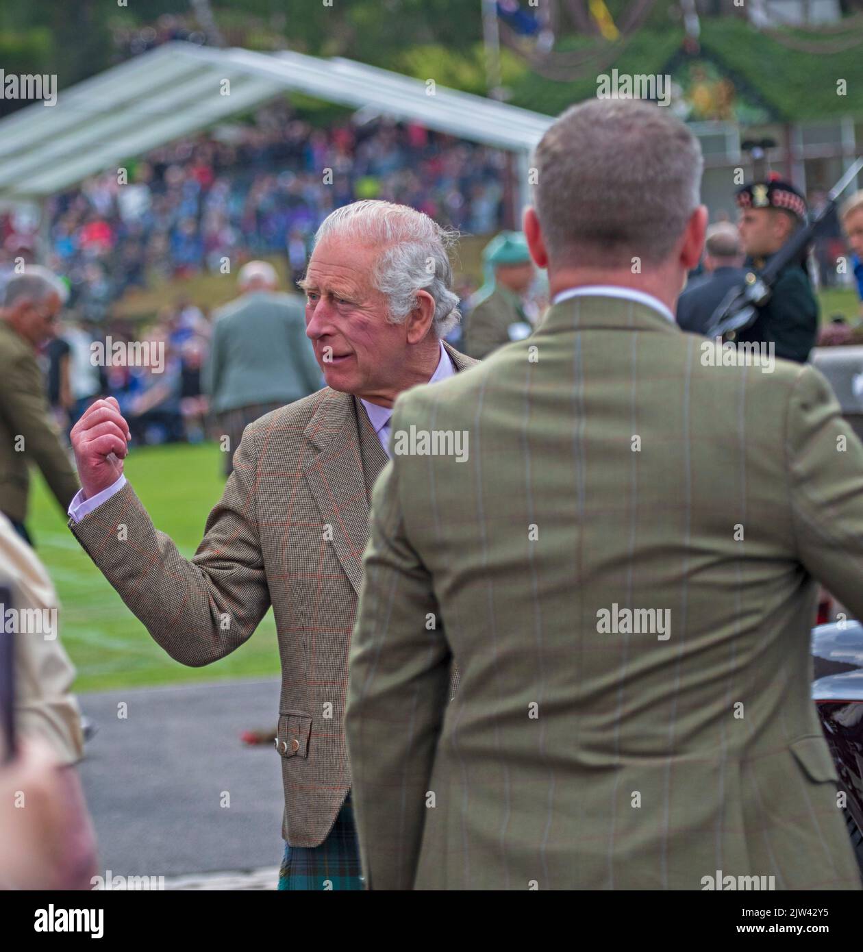 Braemar, Aberdeenshire Scotland, UK. 3rd September 2022. Braemar Royal Highland Gathering 2022. Mass Pipe Bands and highland games kept a capacity audience entertained on a dull day but dry. Pictured Prince Charles Prince of Wales, Duke of Rothesay Stock Photo