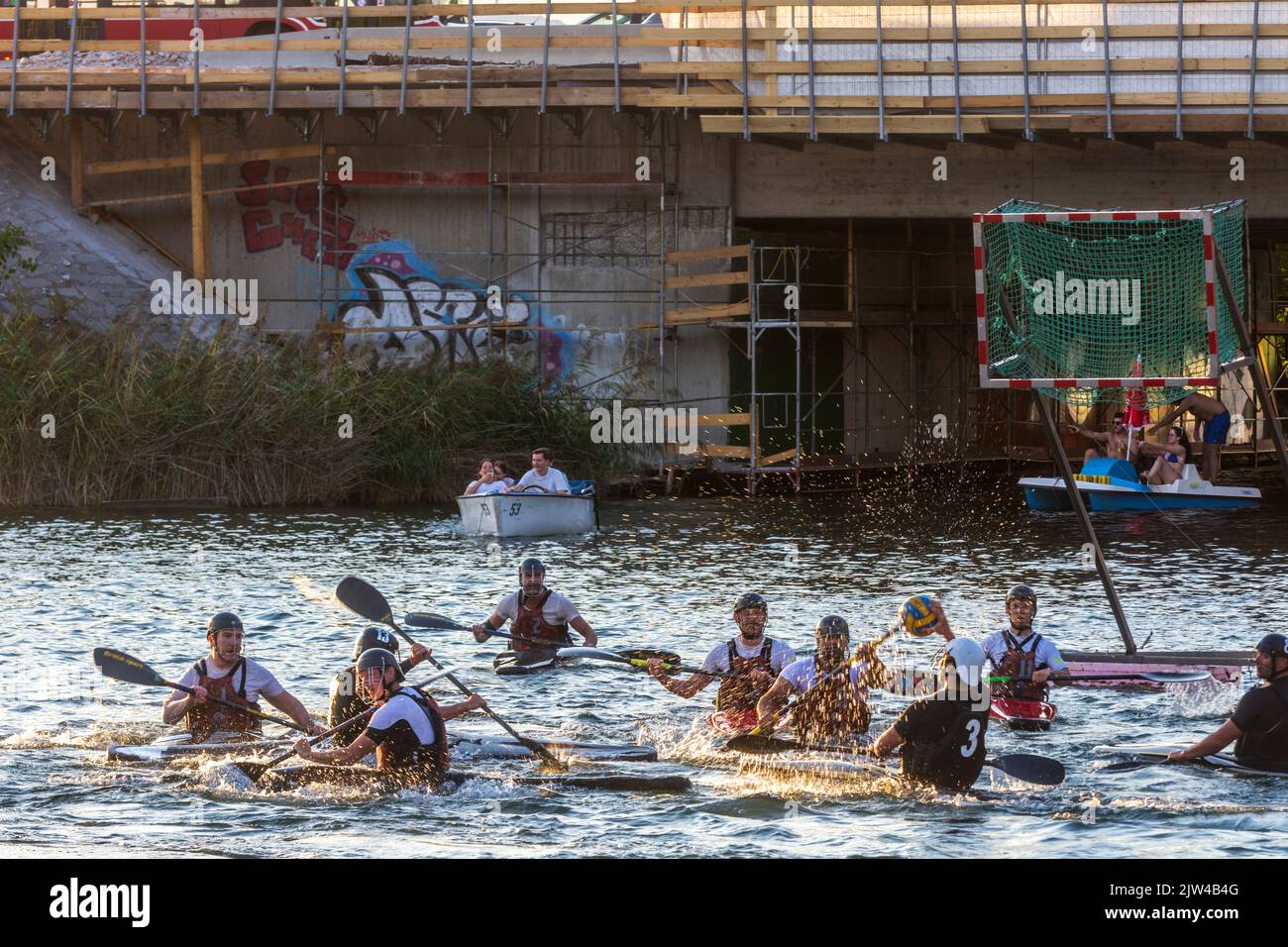Wien, Vienna kanu polo paddler in a competition game on oxbow lake