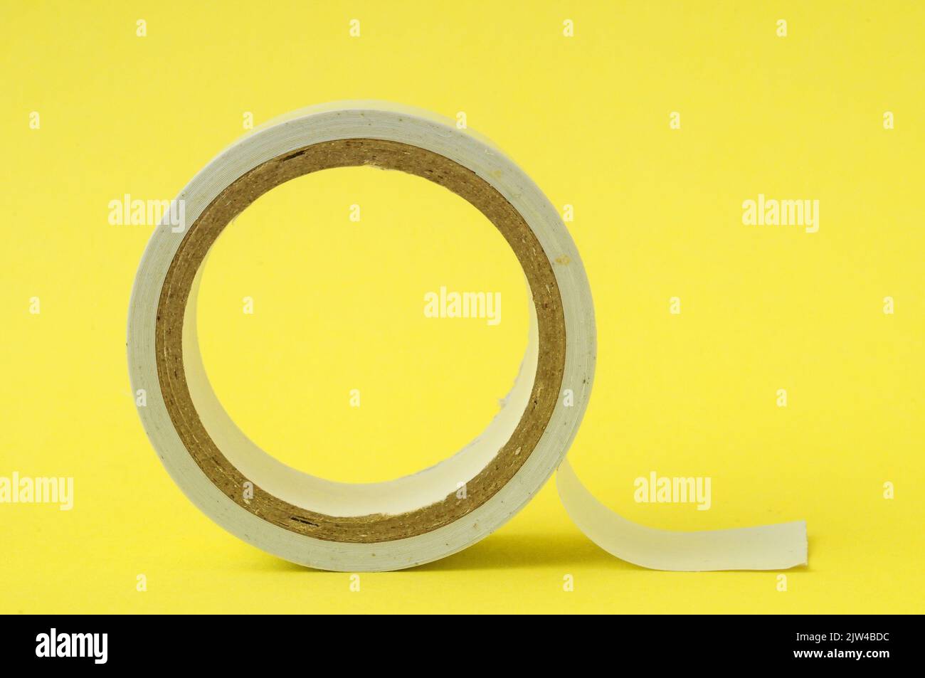 Tape roll yellow hi-res stock photography and images - Alamy
