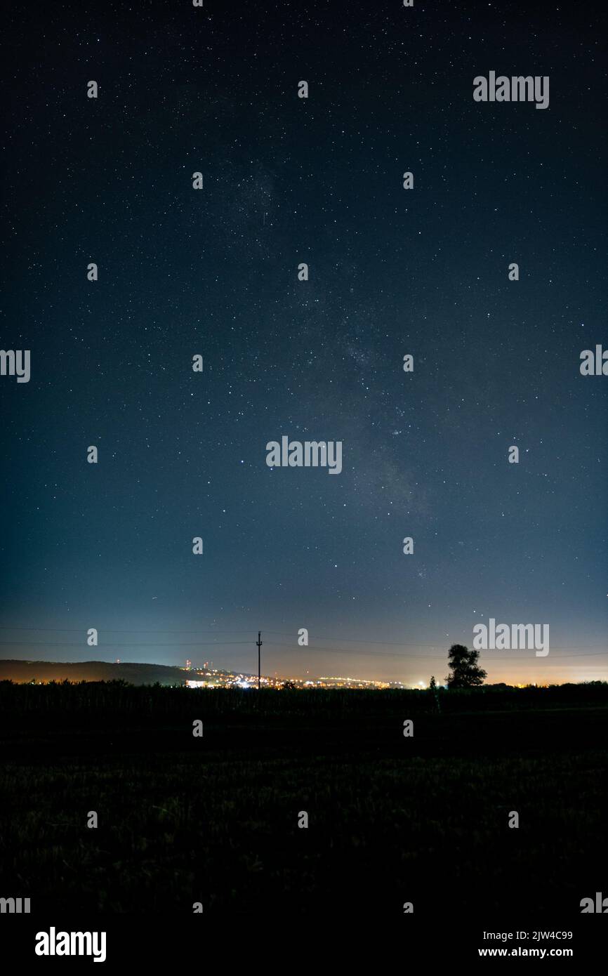 Milky Way over the city of Târgu Mureș, Romania Stock Photo