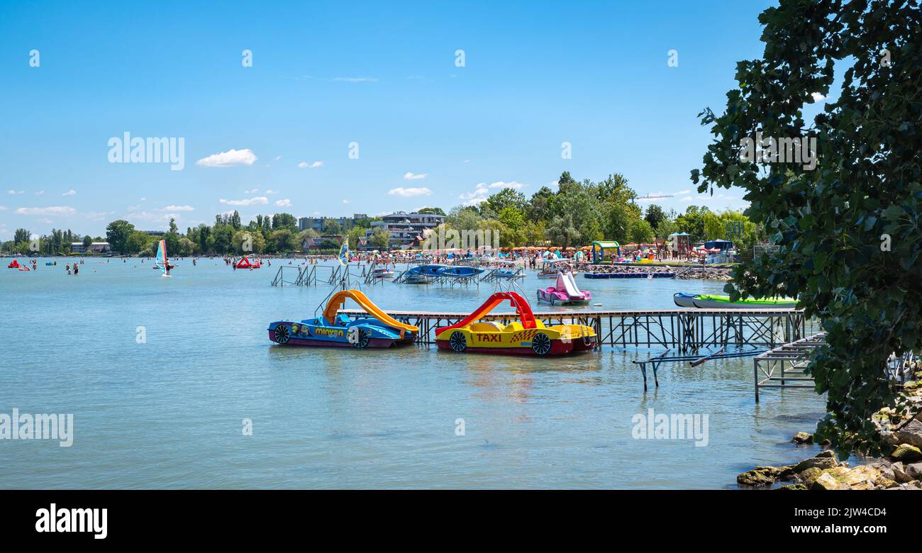 Touristic watercrafts on the shore of Lake Balaton in tourist resort of Balatonlelle, Hungary Stock Photo