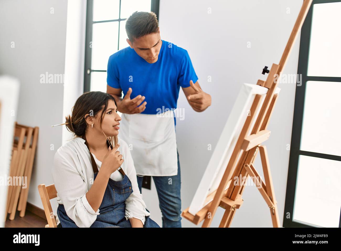 Teacher furious with paint student at art school Stock Photo - Alamy