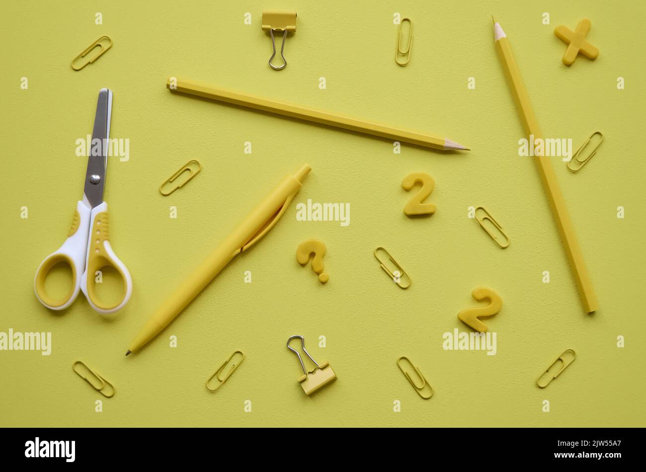 School stationery products on yellow background, flatlay. Back to school Stock Photo