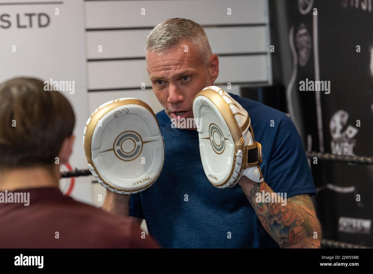 Brentwood Essex 3rd September 2022 Thomas Skinner (The Apprentice and Celebrity Master Chief) opens his latest business venture, the Bosh Gym in Brentwood Essex UK. Chad Ouzman, a boxing instructor tries some sparing Credit: Ian Davidson/Alamy Live News Stock Photo