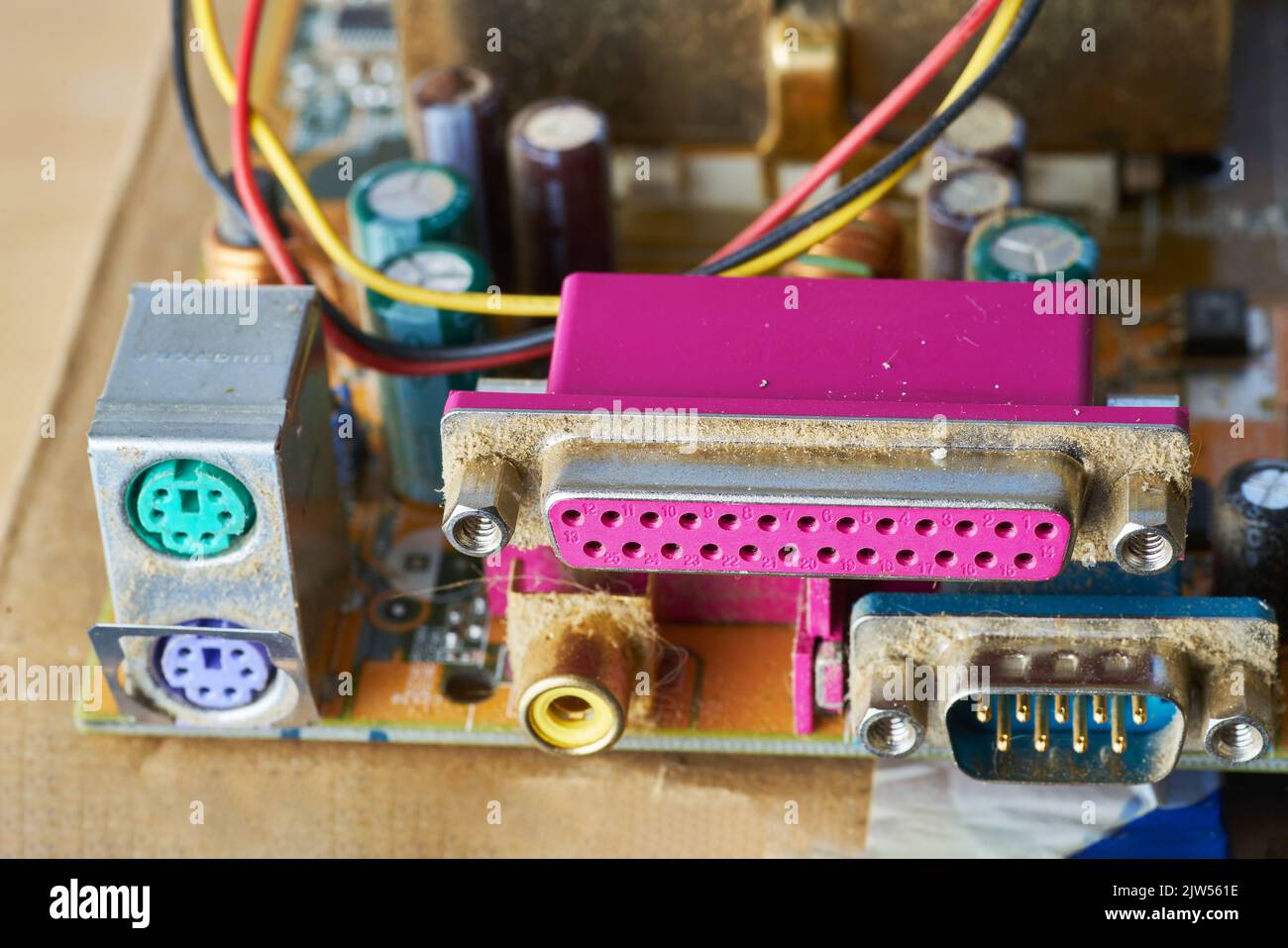 A thick layer of dust covers the internal electronic components of the