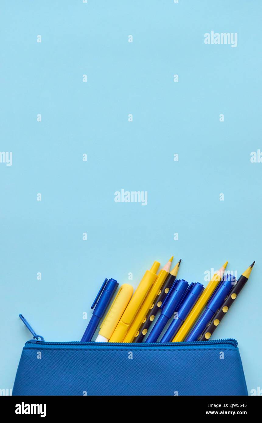 Case with school stationery supplies on grey background, flatlay. Back to school Stock Photo