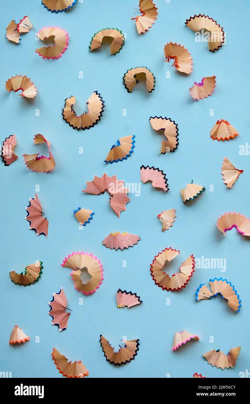 Many color pencils peels pattern isolated on white background, flatlay. Stock Photo