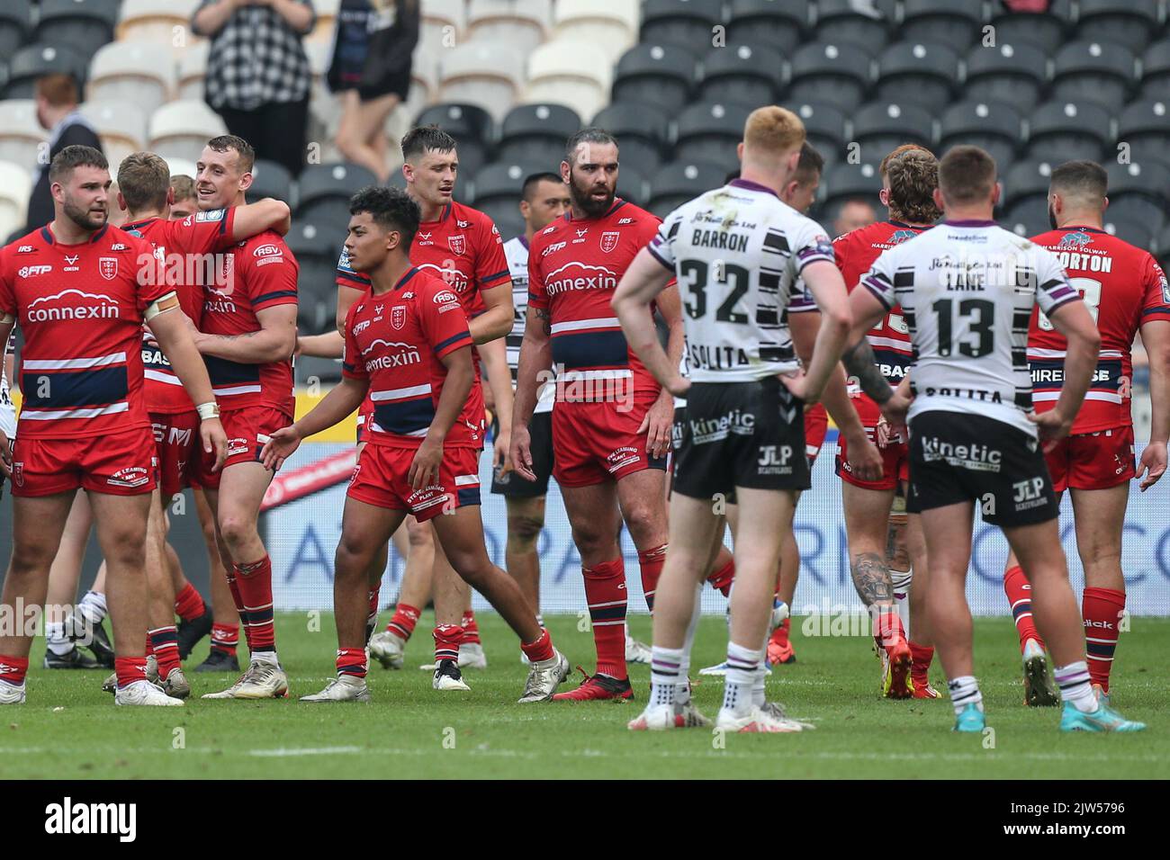 Hull KR players celebrate while Hull FC players can only stand and watch after the Betfred Super League match Hull FC vs Hull KR at MKM Stadium, Hull, United Kingdom, 3rd September