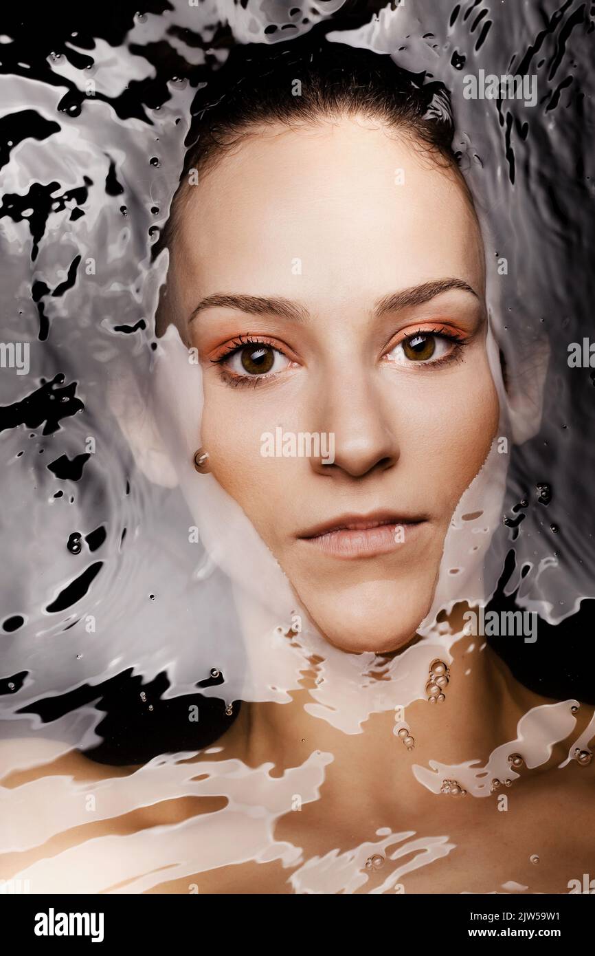 Underwater beauty portrait of a beautiful caucasian girl. Looking at camera. Stock Photo