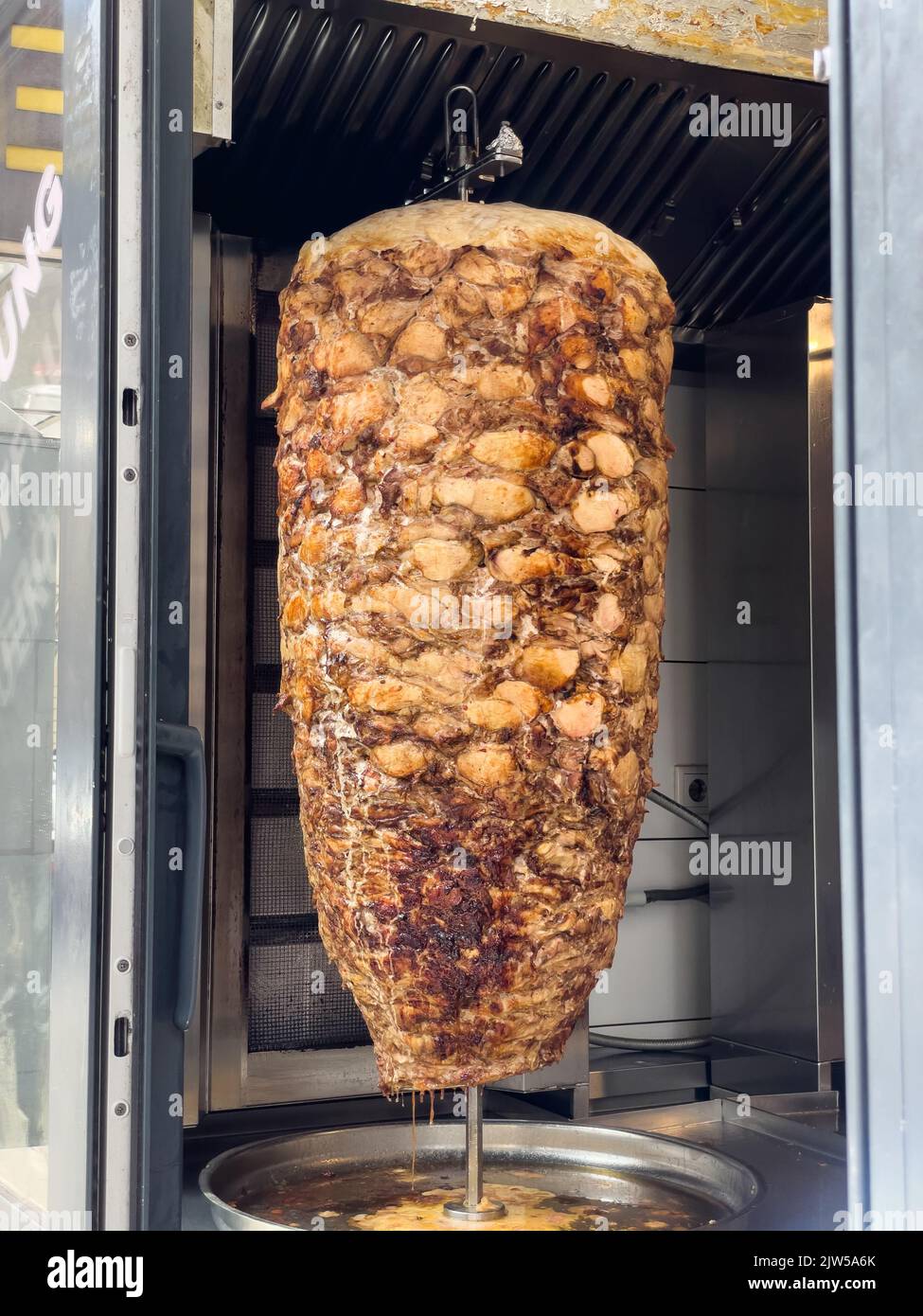Doner Kebab roasting on a stick in Munich, Germany Stock Photo