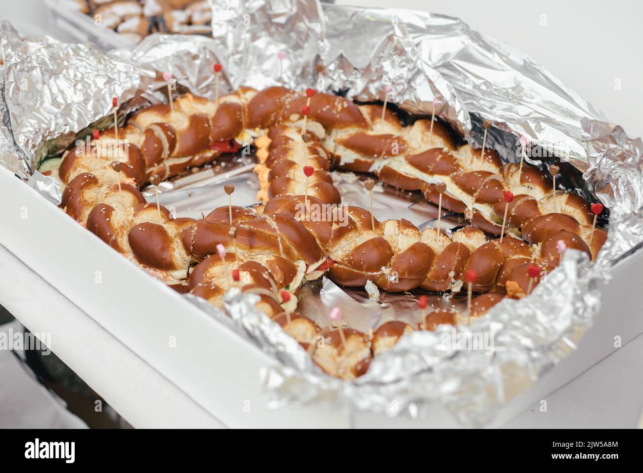 Giant pretzel at a wedding buffet in Bavaria Stock Photo