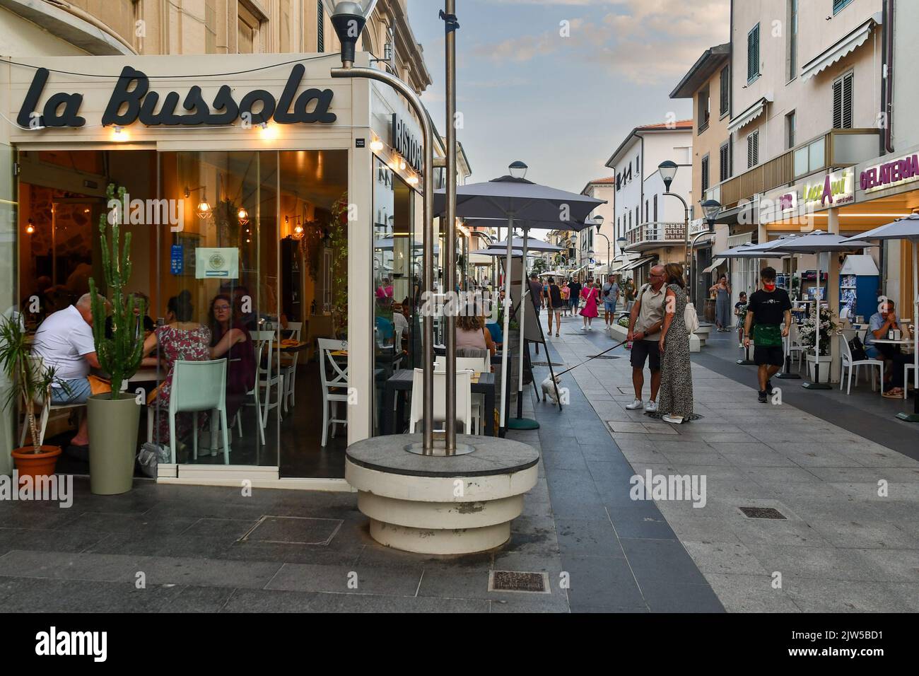 The main street of the sea town on the Etruscan Coast at sunset, San Vincenzo, Livorno, Tuscany, Italy Stock Photo