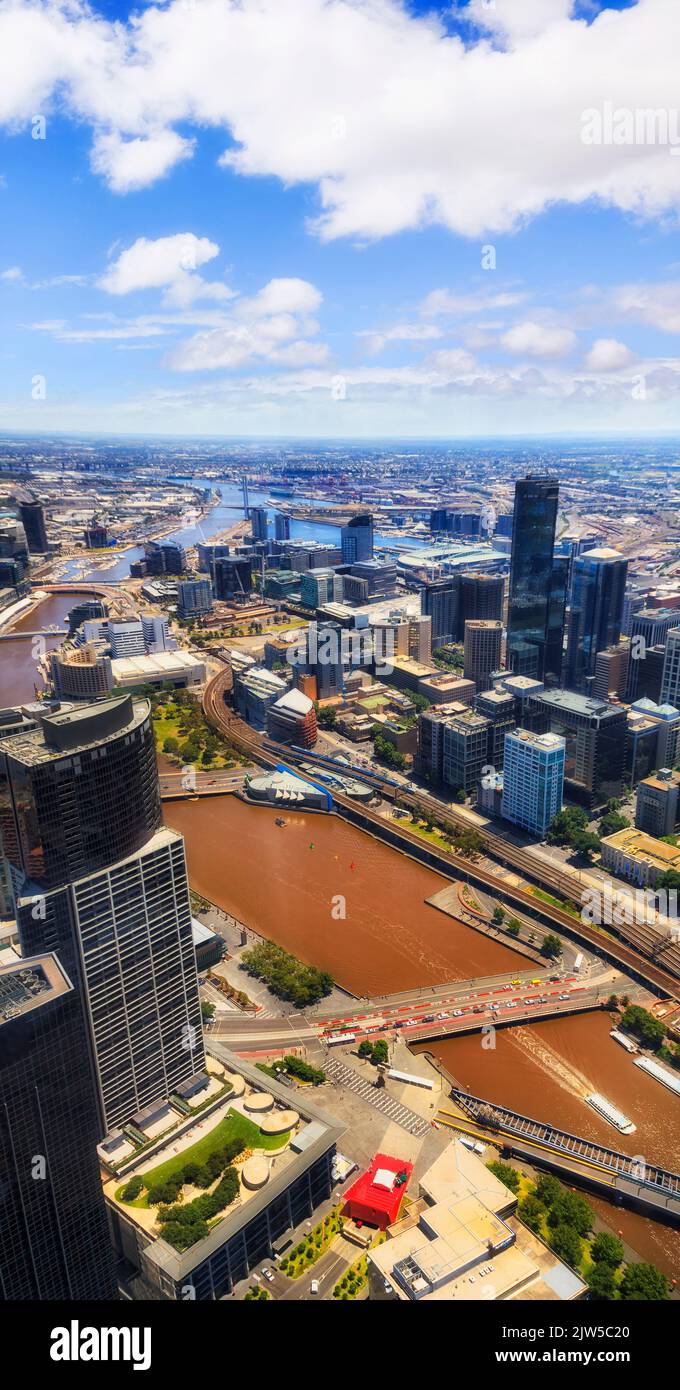 Vertical aerial view of City of Melbourne yarra river banks high-rise towers - urban city architecture. Stock Photo