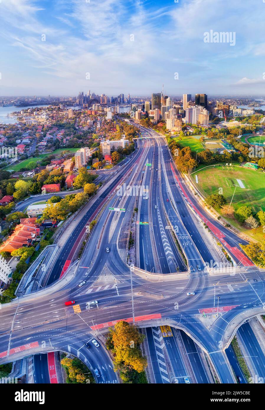 Motorway One Warringah freeway in Sydney city CBD - vertical aerial panorama over intersections and NOrth Sydney high-rise towers to harbour. Stock Photo