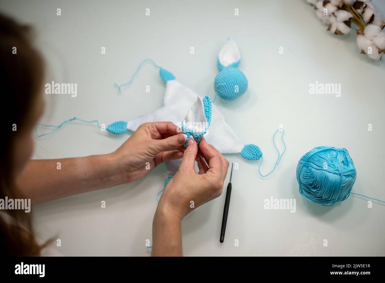 Knitted Making Process knitted toy bunny in the process of making with your own hands Stock ...
