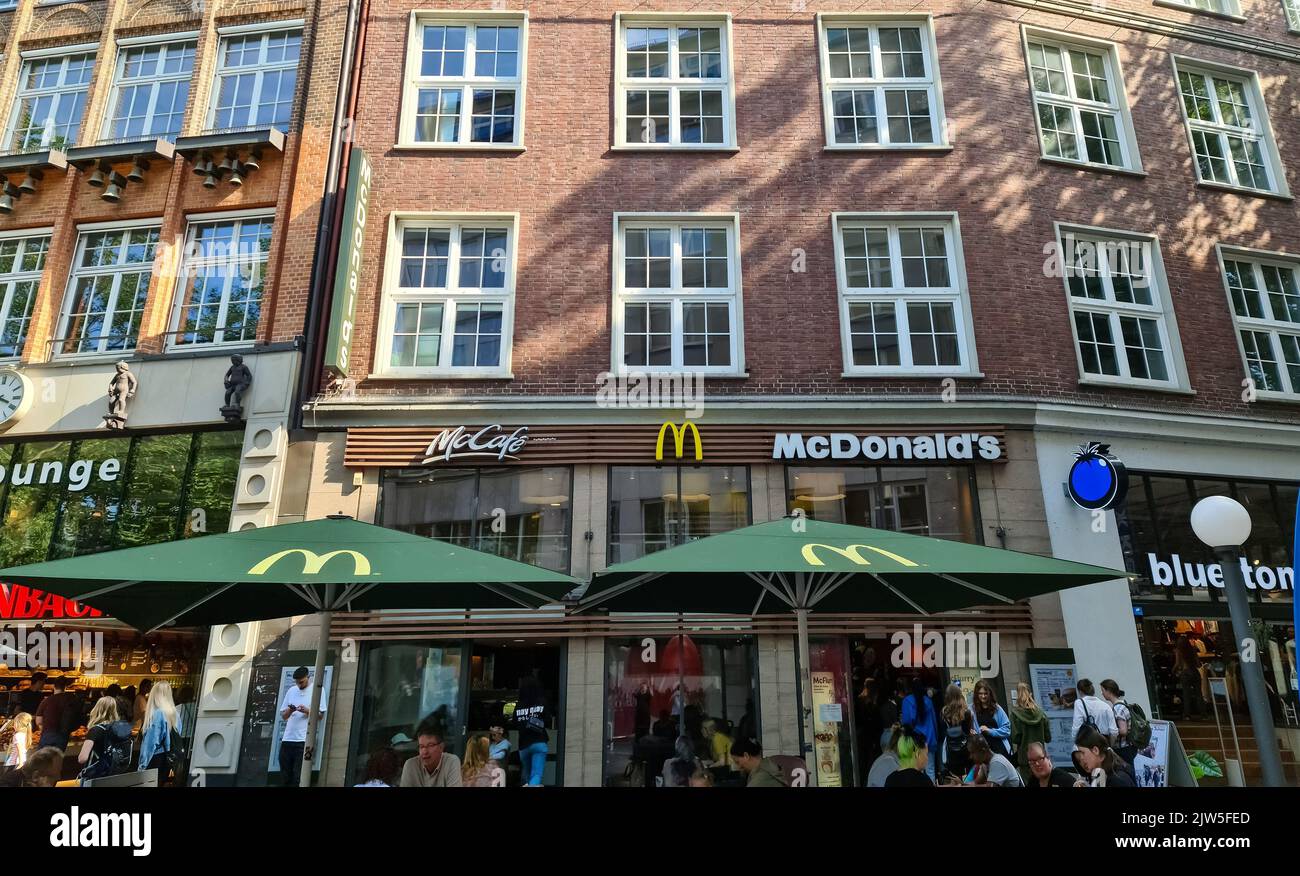 Hamburg, Germany - 03 September 2022: Entrance of a McDonalds and McCafe branch in Hamburg's city centre. Stock Photo