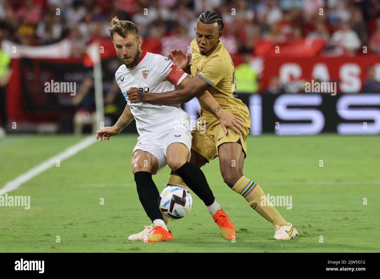 Seville, Seville, Spain. 3rd Sep, 2022. Ivan Rakitic of Sevilla FC competes for the ball with Jules Kounde of FC Barcelona during the La Liga Santader match between Sevilla CF and FC Barcelona at Ramon Sanchez Pizjuan in Seville, Spain, on September 03, 2022. (Credit Image: © Jose Luis Contreras/DAX via ZUMA Press Wire) Stock Photo