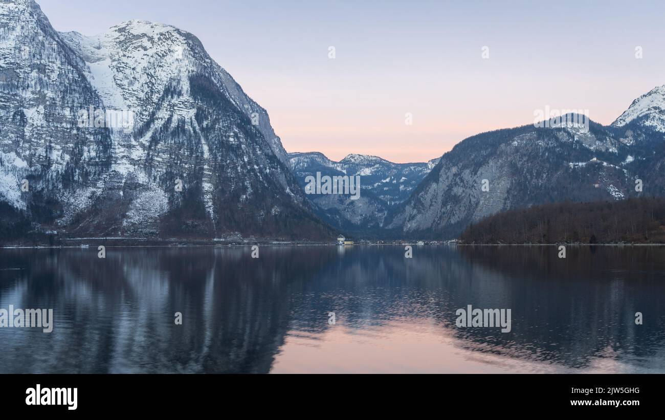 Beautiful alpine lake reflecting surrounding peaks during sunrise, narrow shot, Austria, Europe Stock Photo