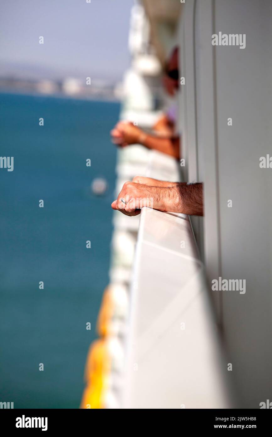 Balcony view on Royal Caribbean Anthem of the Seas with hands visible Stock Photo