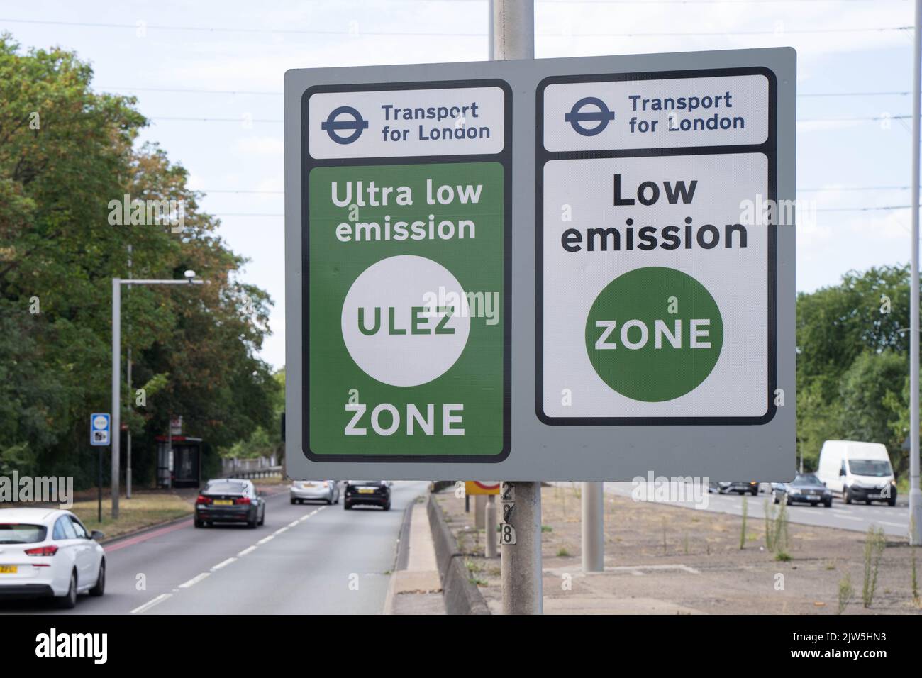 vehicles driving pass TFL  signages for ULEZ  - Ultra Low Emission Zone , and LEZ - low emission zone operates in greater London England UK Stock Photo