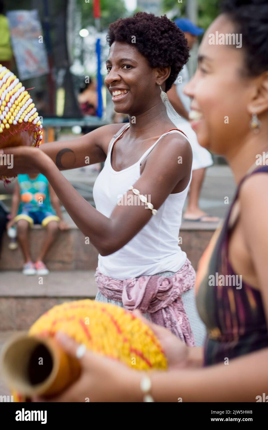 Salvador, Bahia, Brazil - September 17, 2016: Women playing Abe or Xequere, percussion musical instrument created in Africa. Salvador, Bahia, Campo Gr Stock Photo