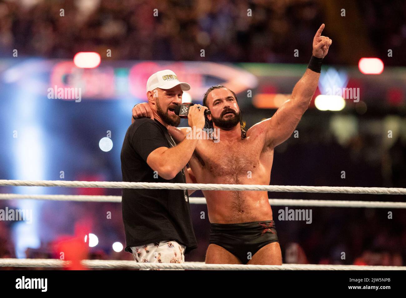 Cardiff, Wales, UK. 3rd Sep, 2022. Tyson Fury and Drew McIntyre sing with the crowd during the WWE ‘Clash At The Castle' wrestling event at the Principality Stadium in Cardiff. Credit: Mark Hawkins/Alamy Live News Stock Photo