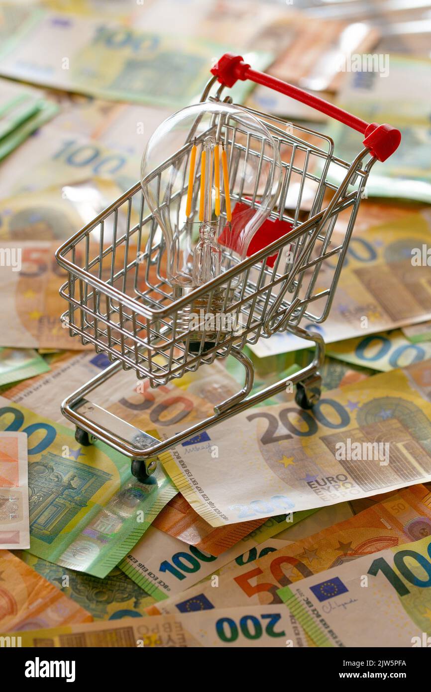 Electricity cost. Rising electricity prices in Europe. Light bulb in a