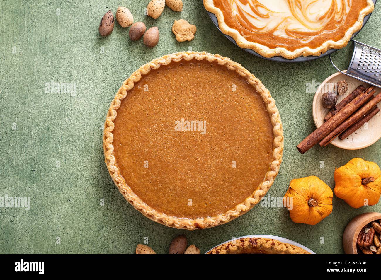 Traditional Thanksgiving pumpkin pie with flaky crust Stock Photo