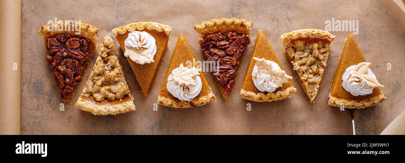 Variety of fall pie slices on parchment paper Stock Photo