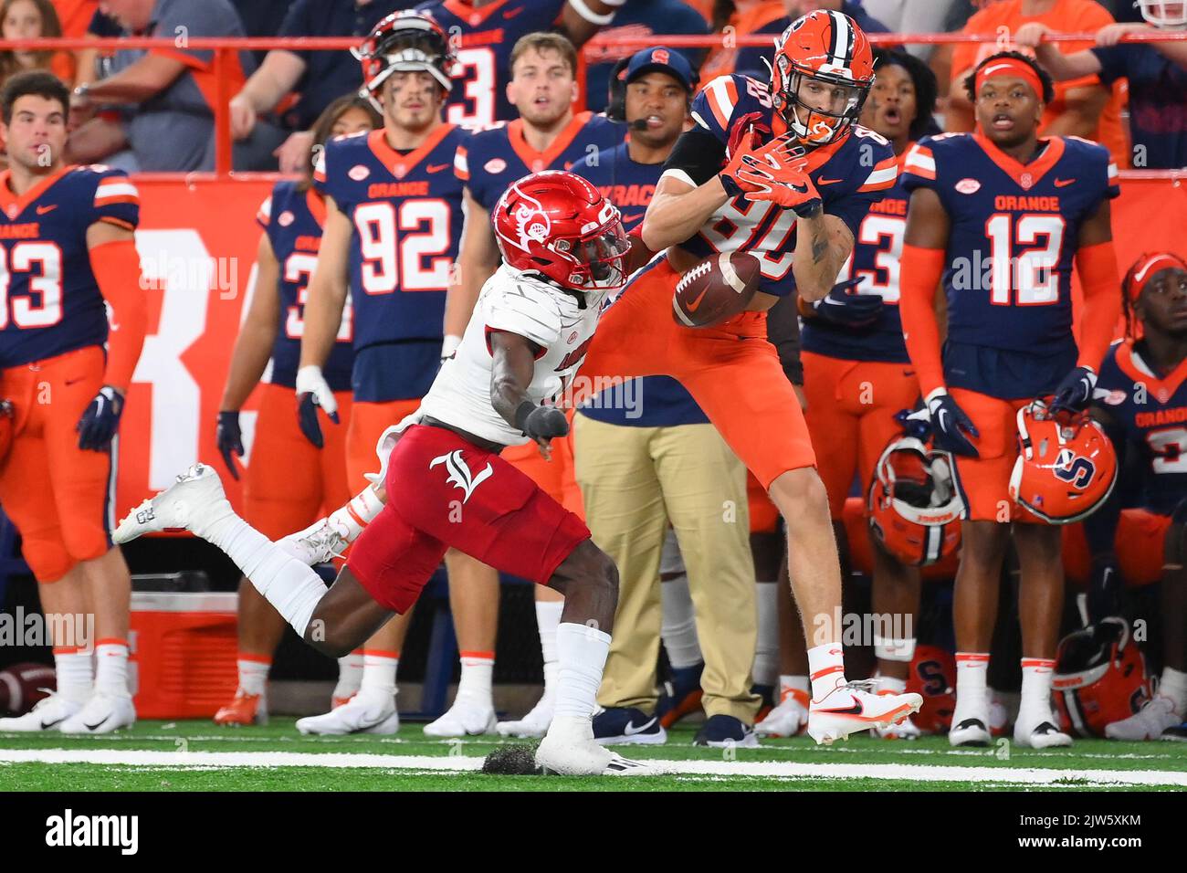 September 03, 2022: Louisville Cardinals cornerback Jarvis Brownlee (12) breaks up a pass intended for Syracuse Orange wide receiver Isaiah Jones (80) during the first half on Saturday, Sep., 3, 2022 at the JMA Wireless Dome in Syracuse, New York. Rich Barnes/CSM Stock Photo