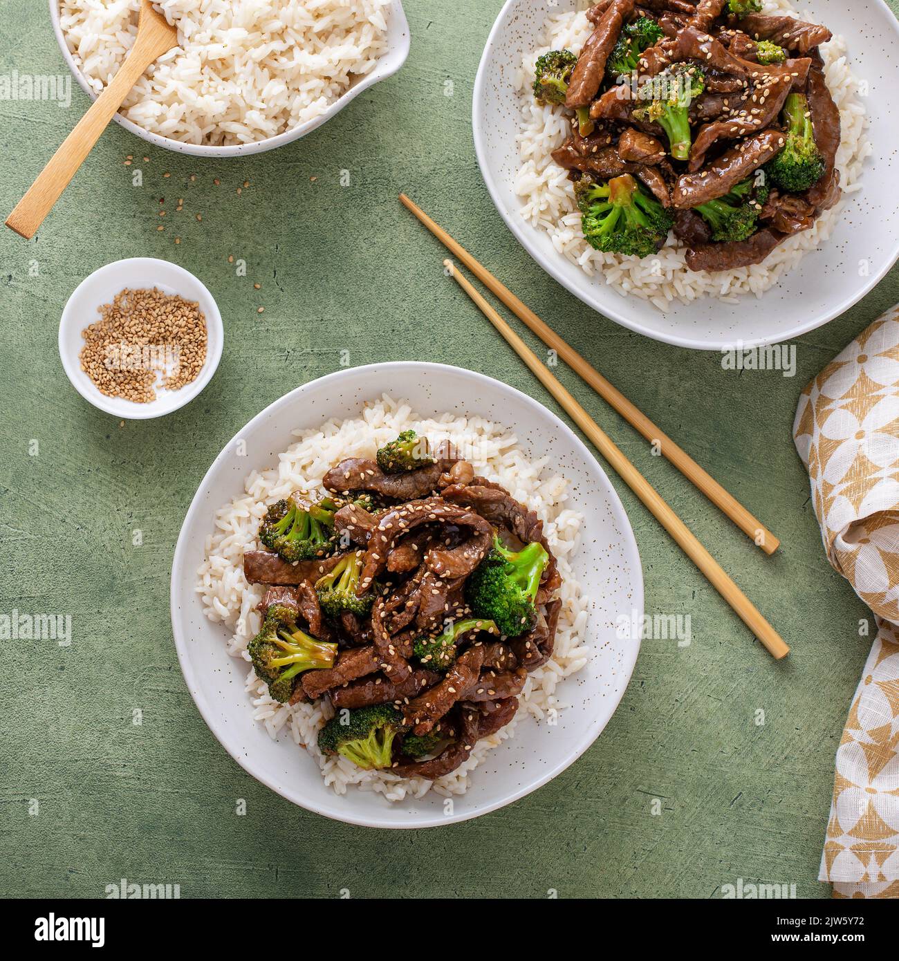 Beef and broccoli stir fry served over rice Stock Photo