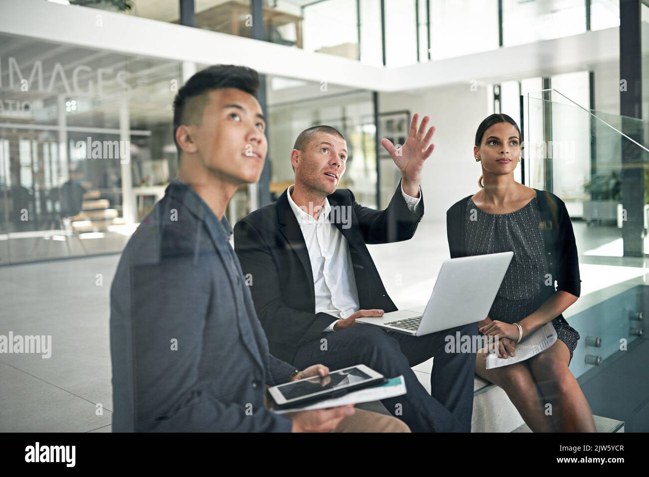 Dream big. three colleagues working in the office. Stock Photo