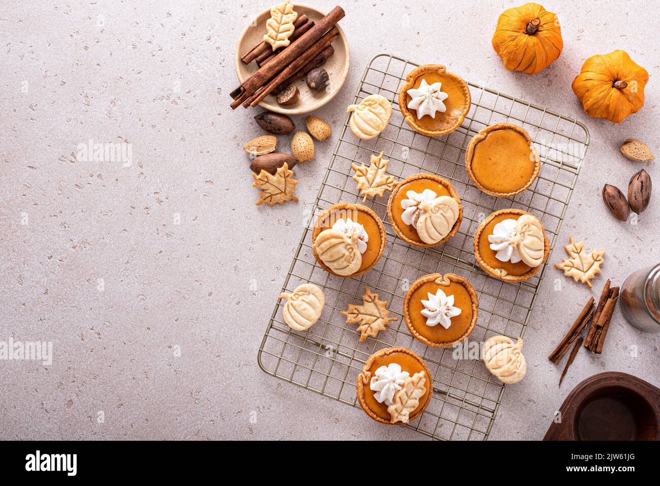 Mini pumpkin pies with wipped cream and cinnamon Stock Photo