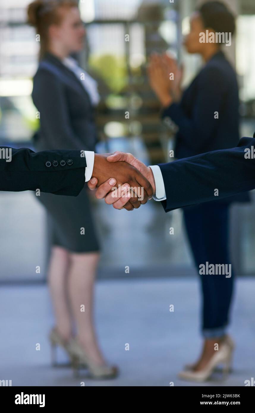 Business bound by trust. two businessmen shaking hands. Stock Photo