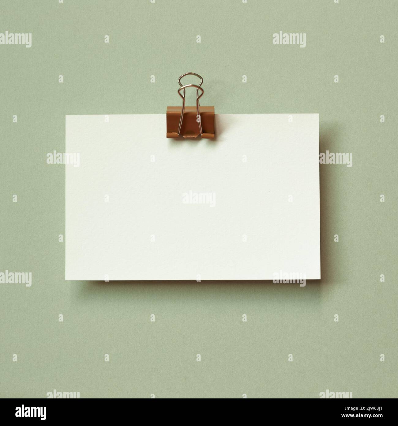 Blank memo pad on green background. copy space Stock Photo